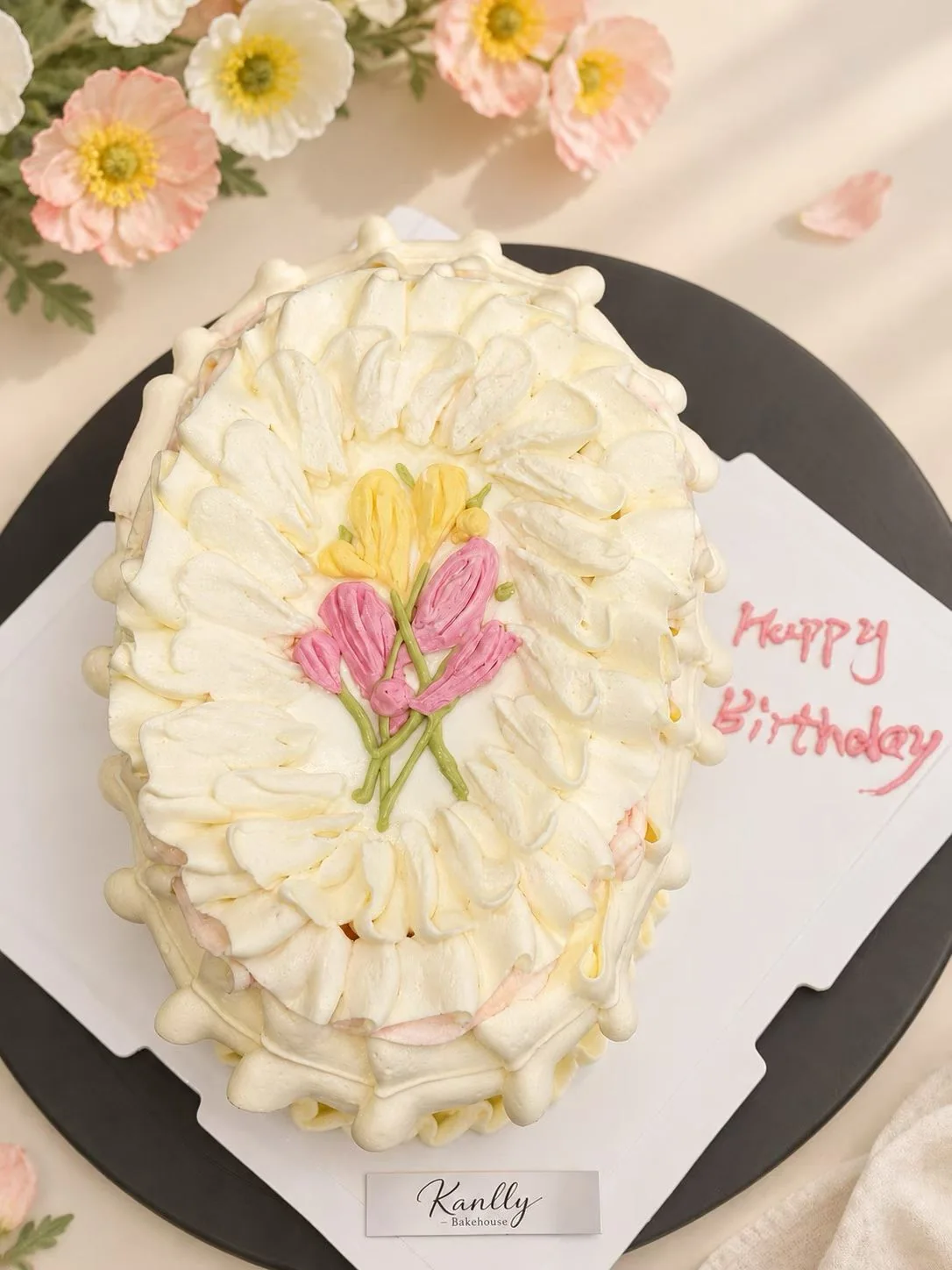Cream cake finished with delicate flowers