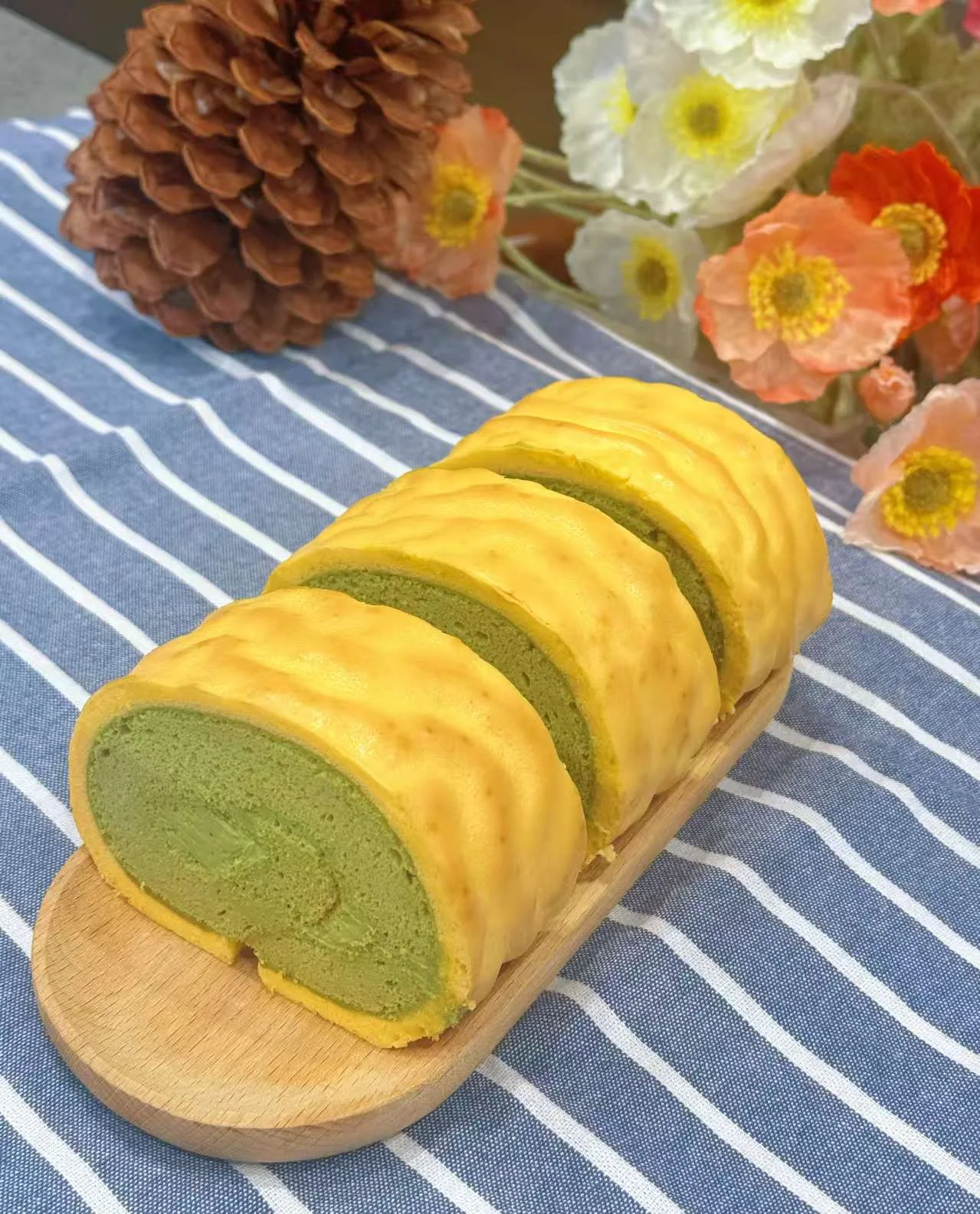 Freshly made green tea Swiss roll